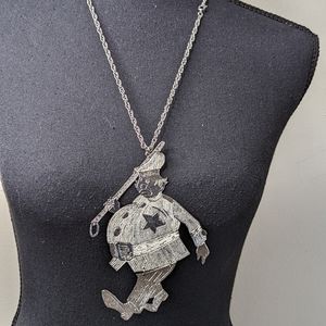 Silver human figurine Necklace Details.